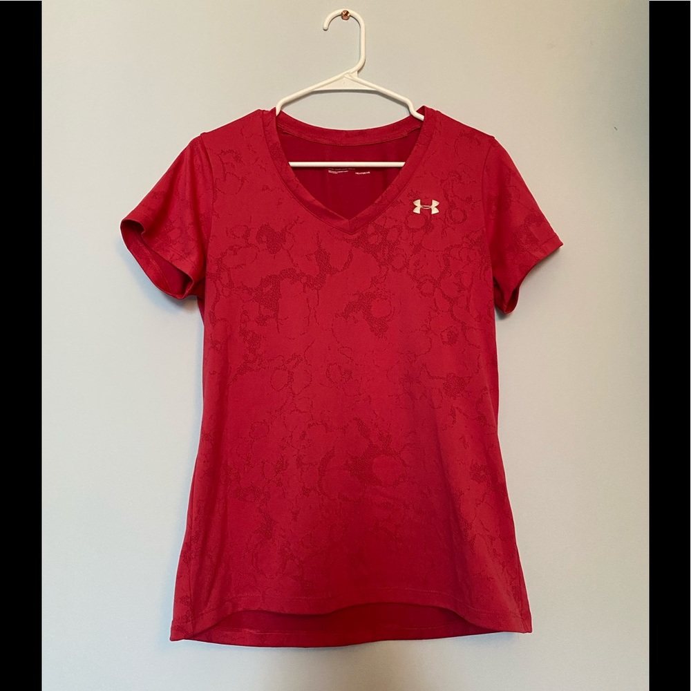 A pink under armor workout tee